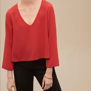 Aritzia “Chelles” cropped loose fit tomato red long sleeve top